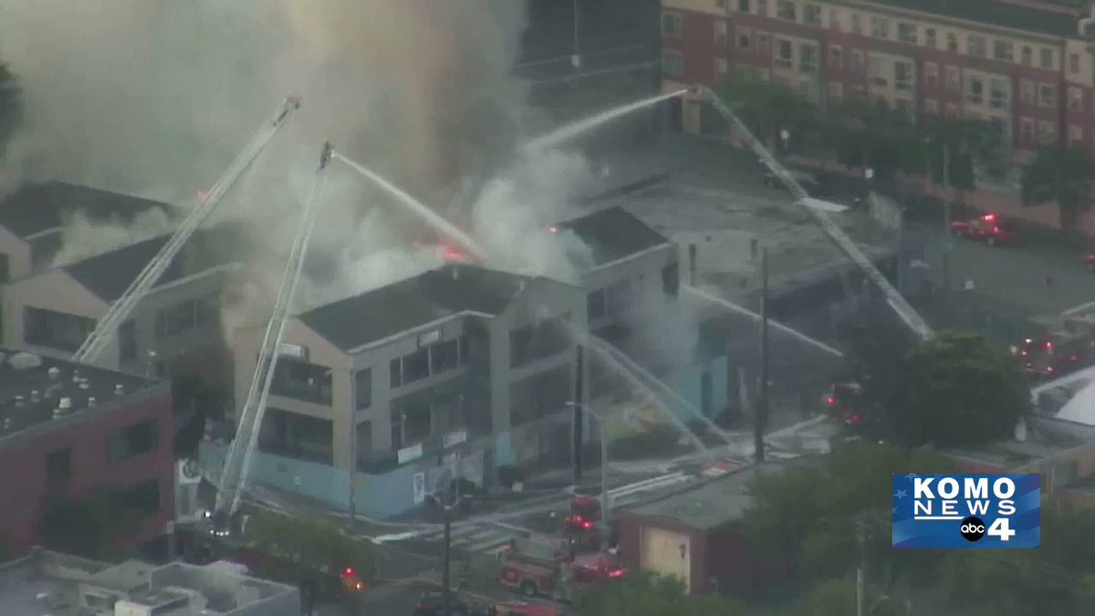 Fire continues to burn in Seattle Chinatown International District @iheartID - this building the Eng Suey Family Plaza. On S. Weller and 8th - several small businesses in the complex. V