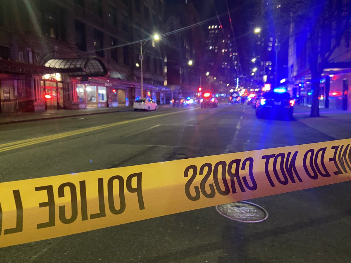 Seattle police say several officers shot and killed a man who fired a rifle and rammed his vehicle into the downtown federal building Saturday night