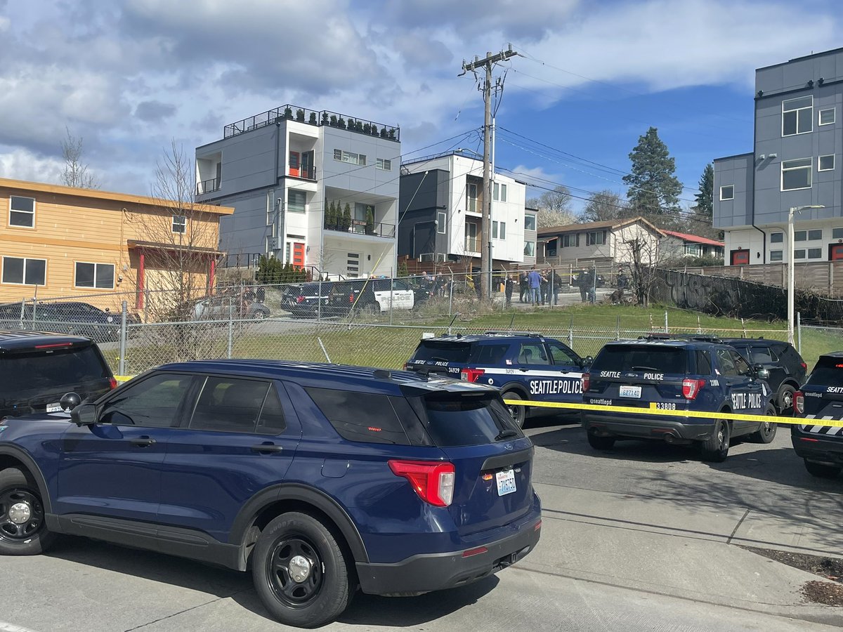 Please investigating the scene in Seattle's Rainier Valley of an officer involved shooting of a suspect in a pot shop robbery in Bellevue. Two suspects in custody. The third was shot at this location. Unconfirmed reports about his condition.  