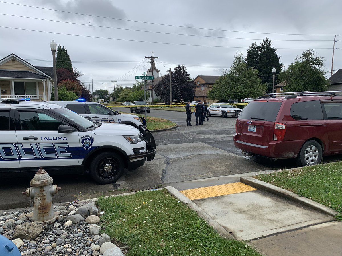 Tacoma: TPD is at the scene of a shooting on 21st between Ainsworth and Cushman. There's a vehicle (3rd pic, slightly obscured by bushes on the left) with a bullet hole in the drivers side window.