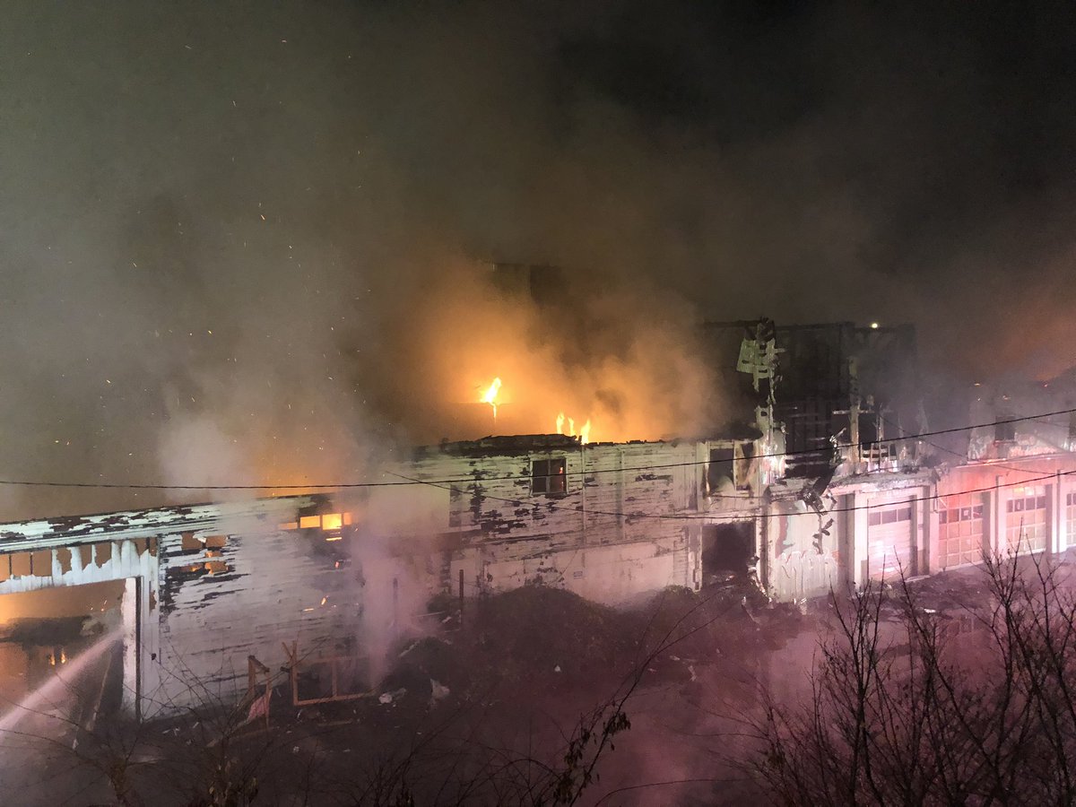 Firefighters continued to put water on a multi alarm fire next to the transit center in downtown Kent. The old commercial building was empty at the time. It is not believed at this time anyone was inside the building when it started