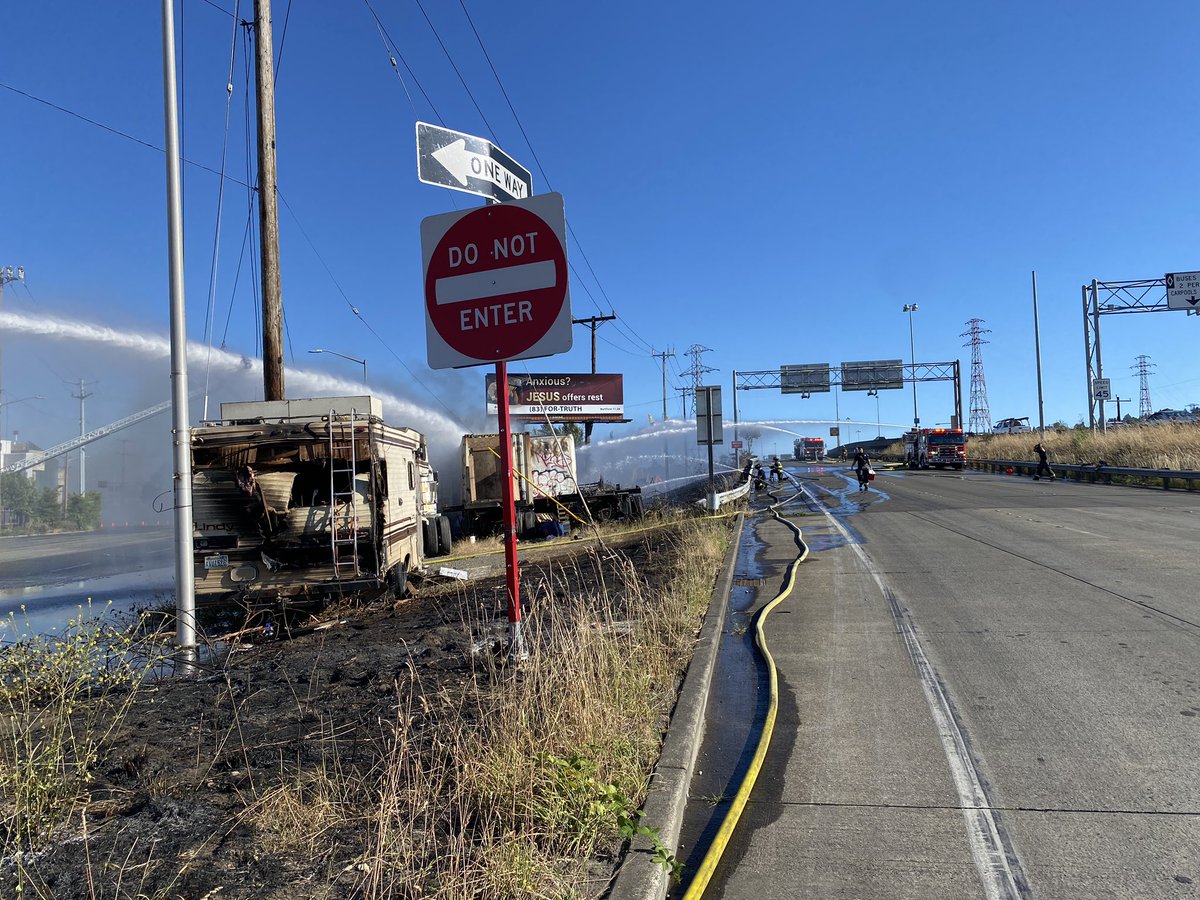 Firefighters are on scene at 1st Ave. S. and East Marginal Way S. for a brushfire that extended to an RV, several semi-trucks and at least two utility poles. Crews have water on the fire and no injuries were reported