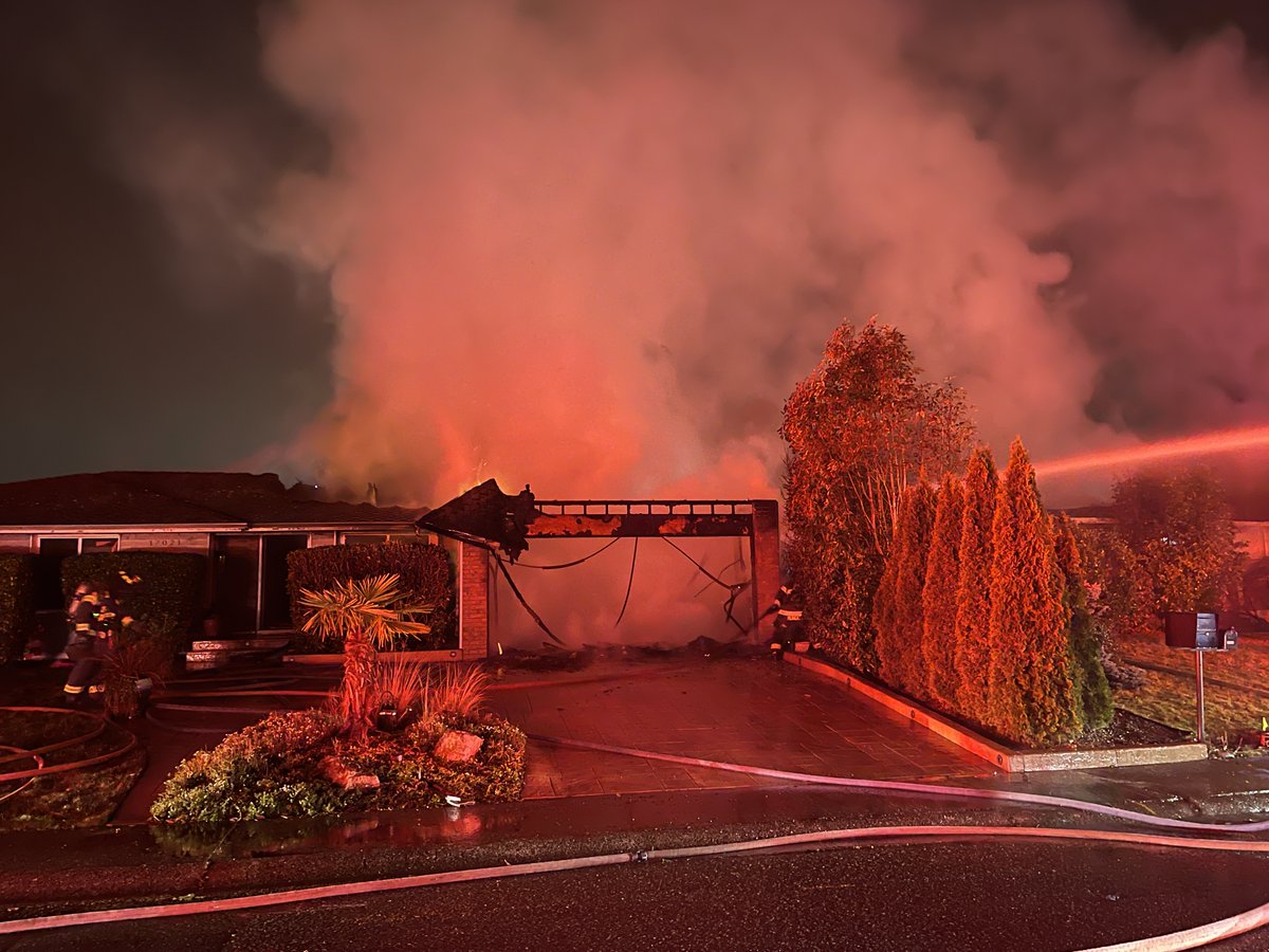 Renton RFA and Puget Sound Fire on location of a 2-alarm house fire in the 17000 block of 159 Place SE. The fire extended to the house next door. Firefighters extinguished the fire in approximately 60 minutes