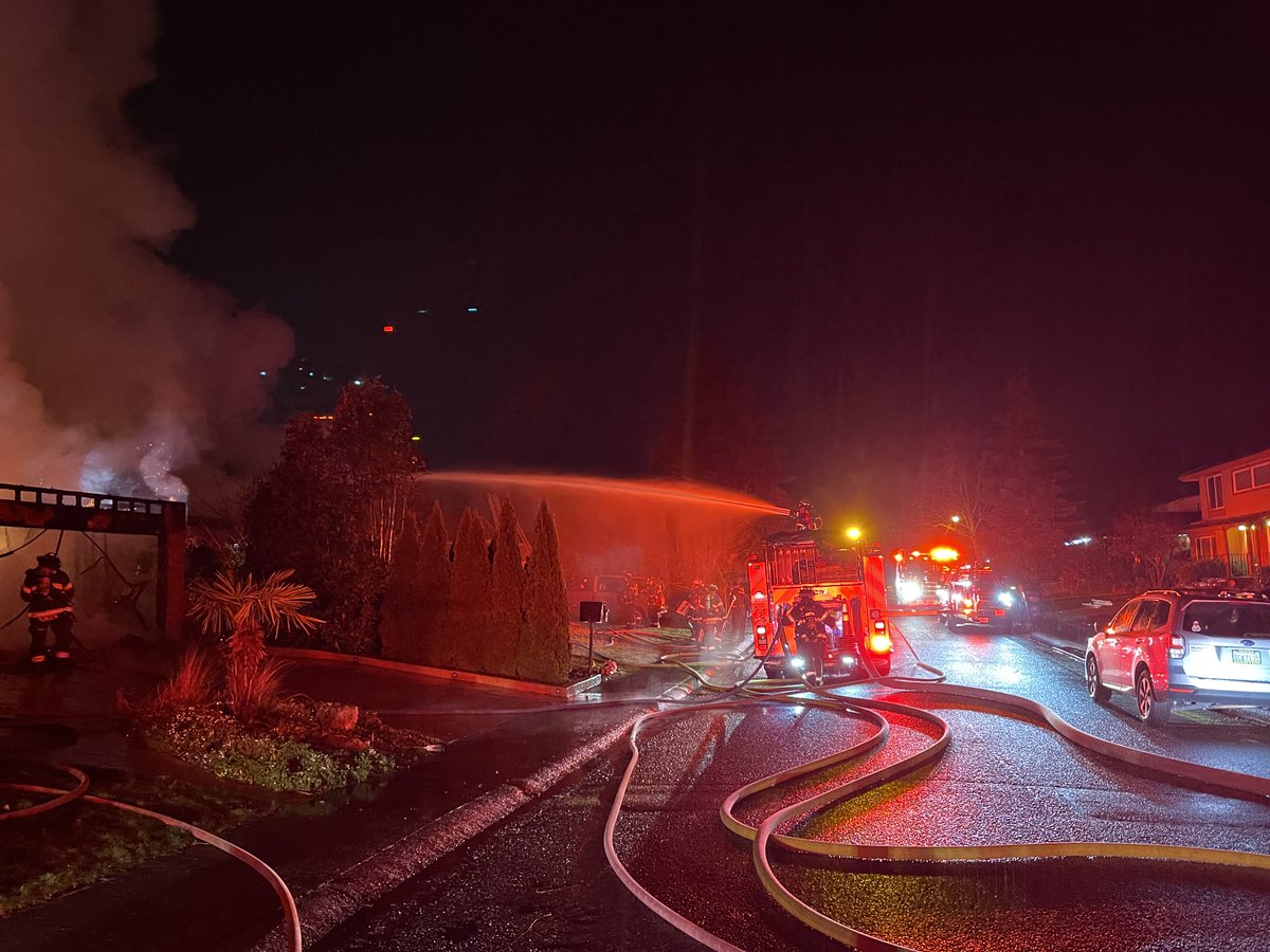 Renton RFA and Puget Sound Fire on location of a 2-alarm house fire in the 17000 block of 159 Place SE. The fire extended to the house next door. Firefighters extinguished the fire in approximately 60 minutes