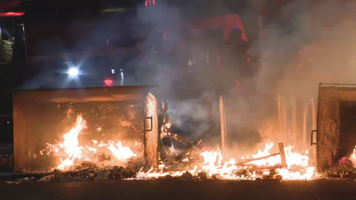 A @wastatepatrol team has set up in front of the fire as @SeattleFire works to extinguish the flames