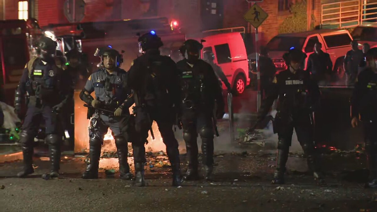 A @wastatepatrol team has set up in front of the fire as @SeattleFire works to extinguish the flames