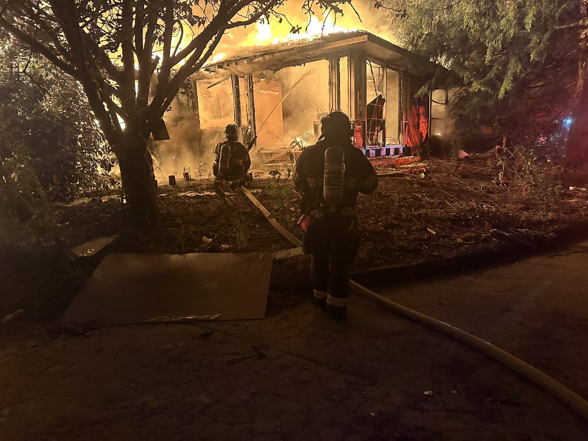 Puget Sound Fire is on scene of a fire in a vacant house in the 21500 block of 108th Avenue SE. firefighters are fighting the fire defensively