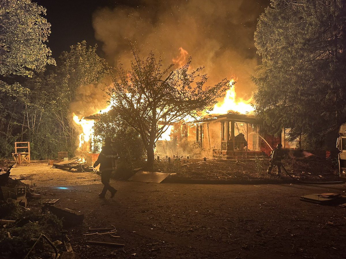 Puget Sound Fire is on scene of a fire in a vacant house in the 21500 block of 108th Avenue SE. firefighters are fighting the fire defensively