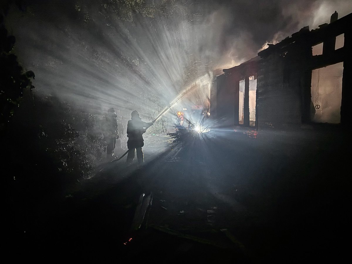 Crews were dispatched to a residential structure fire in the 22500 block of 147th Ave Ct E in Graham. Upon arrival, firefighters found heavy fire conditions with flames visible through the roof. Due to the extent of the fire, crews initiated a defensive fire attack