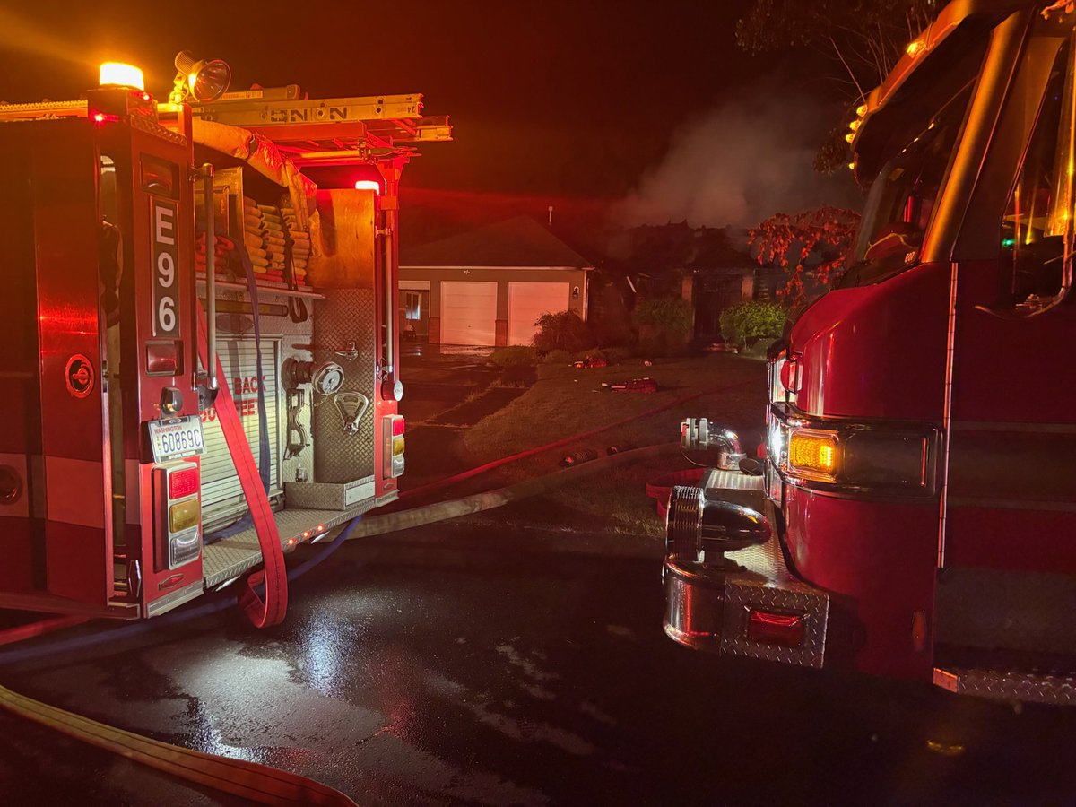 Crews were dispatched to a residential structure fire in the 22500 block of 147th Ave Ct E in Graham. Upon arrival, firefighters found heavy fire conditions with flames visible through the roof. Due to the extent of the fire, crews initiated a defensive fire attack