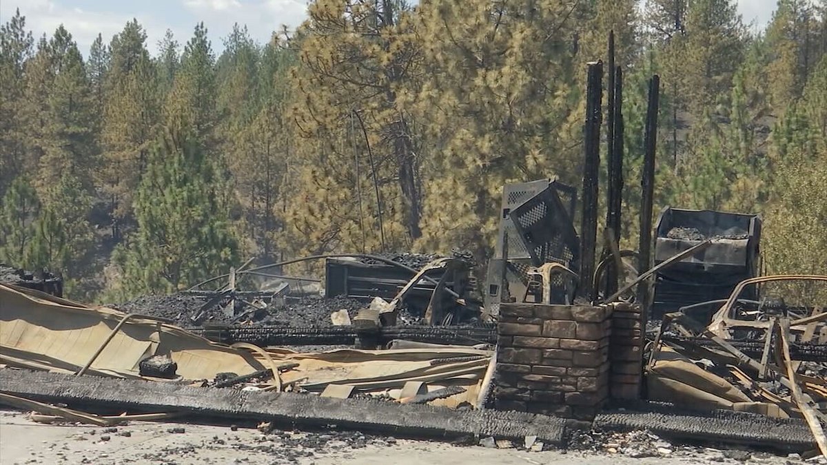 A fast-growing wildfire in Spokane has destroyed at least 15 homes, and 12,000 people are under evacuation orders in Spokane Valley, officials say: